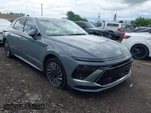 2024 Hyundai Sonata SEL z VIN KMHL34JJ3RA101331, wystawiony jako IAAI lot #42529327 z przebiegiem 11 470 mil mil oraz . Historia ofert i sprzedaży dostępna na DreamBid. Obrazek 1.