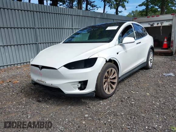 ✅ 2020 Tesla Model X Long Range • VIN: 5YJXCBE23LF263830 • Lot: 42956237. Listed on IAAI with 73,741 mi. Free auction sales archive from the USA and detailed vehicle history report at DreamBid. Image 19.