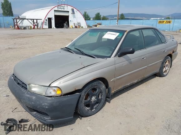 ✅ 1999 Subaru Legacy L • VIN: 4S3BD435XX6263146 • Lot: 42990804. Listed on IAAI with 329,804 mi. Free auction sales archive from the USA and detailed vehicle history report at DreamBid. Image 2.