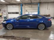 ✅ 2014 Ford Fusion Titanium Hybrid • VIN: 3FA6P0RU6ER175894 • Lot: 43220307. Listed on IAAI with 157,170 mi. Free auction sales archive from the USA and detailed vehicle history report at DreamBid. Image 14.