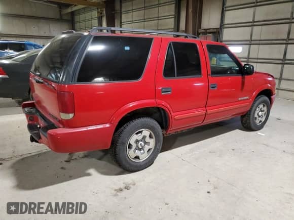 2002 Chevrolet Blazer LS z VIN 1GNDT13WX2K174090, wystawiony jako Copart lot #81279404 z przebiegiem 168 373 mil mil oraz Szkoda całkowita • Salvage title. Historia ofert i sprzedaży dostępna na DreamBid. Obrazek 3.