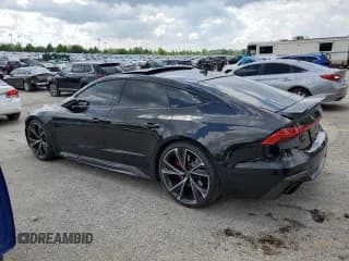 ✅ 2022 Audi RS 7 • VIN: WUAPCBF27NN905150 • Лот: 55993395. Опубликован ранее на Copart с пробегом 30 948 миль. Бесплатный доступ к архиву аукционных продаж из США и подробный отчёт об истории автомобиля на DreamBid. Изображение 2.