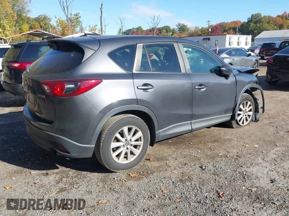 ✅ 2016 Mazda CX-5 Touring • VIN: JM3KE4CY5G0716056 • Lot: 43521281. Listed on IAAI with 107,968 mi. Free auction sales archive from the USA and detailed vehicle history report at DreamBid. Image 4.