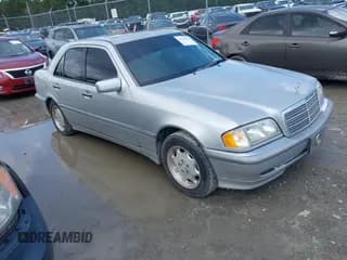 ✅ 1999 Mercedes-Benz C 230/260/280/320 • VIN: WDBHA29GXXA806233 • Lot: 42729874. Listed on IAAI with 312,956 mi. Free auction sales archive from the USA and detailed vehicle history report at DreamBid. Image 1.