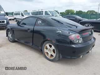 2003 Hyundai Tiburon GT с VIN KMHHN65F63U072432, выставлен на аукционе IAAI как лот 42813911 с пробегом 162 894 миль миль и . История ставок и продаж доступна на DreamBid. Изображение 3.
