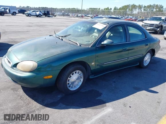 ✅ 1999 Mercury Sable LS • VIN: 1MEFM53S7XA612899 • Lot: 41687188. Listed on IAAI with 155,128 mi. Free auction sales archive from the USA and detailed vehicle history report at DreamBid. Image 2.