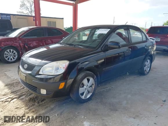 ✅ 2009 Kia Rio LX • VIN: KNADE223496561265 • Лот: 42143889. Опубликован ранее на IAAI с пробегом 235 634 миль. Бесплатный доступ к архиву аукционных продаж из США и подробный отчёт об истории автомобиля на DreamBid. Изображение 2.