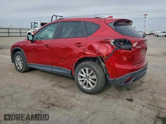 ✅ 2016 Mazda CX-5 Sport • VIN: JM3KE2BY5G0744980 • Лот: 91403285. Опубликован ранее на Copart с пробегом 84 231 миль. Бесплатный доступ к архиву аукционных продаж из США и подробный отчёт об истории автомобиля на DreamBid. Изображение 2.