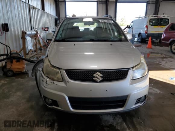 ✅ 2010 Suzuki SX4 • VIN: JS2YB5A31A6311329 • Lot: 85900435. Wystawiony na Copart z przebiegiem 131 172 mil. Bezpłatny archiwum sprzedaży aukcyjnych z USA i szczegółowy raport historii pojazdu na DreamBid. Zdjęcie 5.