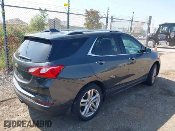 2018 Chevrolet Equinox Premier z VIN 3GNAXWEX1JS504549, wystawiony jako IAAI lot #43256484 z przebiegiem 64 262 mil mil oraz . Historia ofert i sprzedaży dostępna na DreamBid. Obrazek 4.