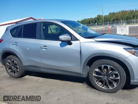 ✅ 2016 Mazda CX-5 Grand Touring • VIN: JM3KE4DY3G0609490 • Лот: 43417943. Опубликован ранее на IAAI с пробегом 243 145 миль. Бесплатный доступ к архиву аукционных продаж из США и подробный отчёт об истории автомобиля на DreamBid. Изображение 13.