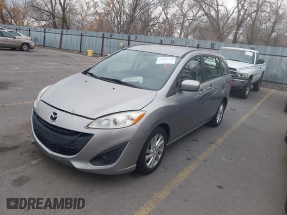 ✅ 2012 Mazda 5 Sport • VIN: JM1CW2BL8C0101127 • Lot: 43899580. Wystawiony na IAAI z przebiegiem 176 755 mil. Bezpłatny archiwum sprzedaży aukcyjnych z USA i szczegółowy raport historii pojazdu na DreamBid. Zdjęcie 2.