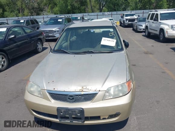 ✅ 2002 Mazda Protege DX • VIN: JM1BJ225521591241 • Лот: 42768329. Опубликован ранее на IAAI с пробегом 193 642 миль. Бесплатный доступ к архиву аукционных продаж из США и подробный отчёт об истории автомобиля на DreamBid. Изображение 6.