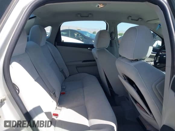 2013 Chevrolet Impala LS z VIN 2G1WF5E35D1265220, wystawiony jako IAAI lot #42559869 z przebiegiem 124 046 mil mil oraz . Historia ofert i sprzedaży dostępna na DreamBid. Obrazek 8.