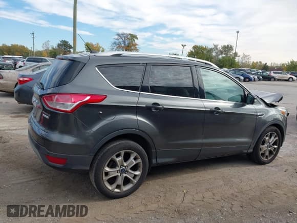 ✅ 2015 Ford Escape Titanium • VIN: 1FMCU0JX8FUB71346 • Lot: 43558511. Listed on IAAI with 127,729 mi. Free auction sales archive from the USA and detailed vehicle history report at DreamBid. Image 14.