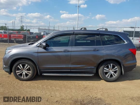 ✅ 2017 Honda Pilot EX-L • VIN: 5FNYF6H54HB014405 • Lot: 43214227. Listed on IAAI with 119,445 mi. Free auction sales archive from the USA and detailed vehicle history report at DreamBid. Image 14.