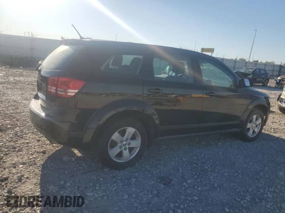 2013 Dodge Journey American Value with VIN 3C4PDCAB5DT597224, listed as a Copart auction lot 82536665 with 104,666 mi miles and Clean title. Bid and sale history available at DreamBid. Image 3.