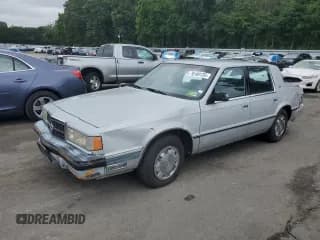 ✅ 1989 Dodge Dynasty • VIN: 1B3BC4634KD442902 • Lot: 70160135. Listed on Copart with 63,120 mi. Free auction sales archive from the USA and detailed vehicle history report at DreamBid. Image 1.