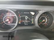 ✅ 2022 Jeep Wrangler Unlimited High Tide • VIN: 1C4HJXDG2NW221829 • Lot: 64836074. Listed on Copart with 3,394 mi. Free auction sales archive from the USA and detailed vehicle history report at DreamBid. Image 9.