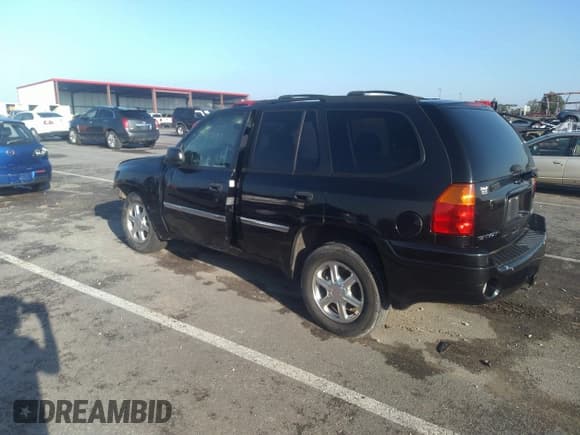 ✅ 2009 GMC Envoy SLE • VIN: 1GKDT33S392129850 • Lot: 31422137. Listed on IAAI with 165,120 mi. Free auction sales archive from the USA and detailed vehicle history report at DreamBid. Image 3.