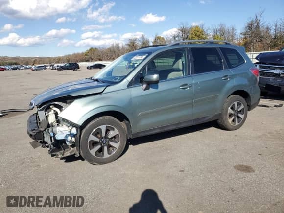 2017 Subaru Forester Limited with VIN JF2SJARC0HH523882, listed as a Copart auction lot 82651095 with 65,088 mi miles and Salvage title. Bid and sale history available at DreamBid. Image 1.