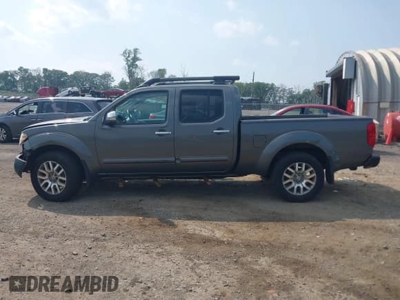 ✅ 2009 Nissan Frontier SE • VIN: 1N6AD09W19C407379 • Lot: 42494543. Listed on IAAI with 209,680 mi. Free auction sales archive from the USA and detailed vehicle history report at DreamBid. Image 14.