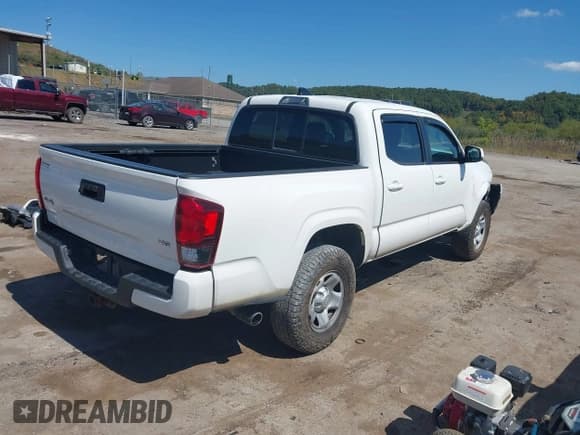 ✅ 2021 Toyota Tacoma SR • VIN: 3TYCZ5AN6MT030881 • Лот: 43217122. Опубликован ранее на IAAI с пробегом 100 699 миль. Бесплатный доступ к архиву аукционных продаж из США и подробный отчёт об истории автомобиля на DreamBid. Изображение 4.