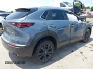 ✅ 2022 Mazda CX-30 S Carbon Edition • VIN: 3MVDMBCL6NM410330 • Lot: 42107426. Listed on IAAI with 30,277 mi. Free auction sales archive from the USA and detailed vehicle history report at DreamBid. Image 4.