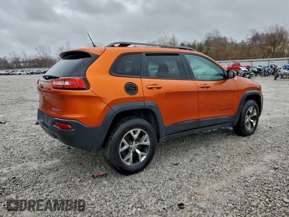 ✅ 2015 Jeep Cherokee Trailhawk • VIN: 1C4PJMBSXFW604095 • Lot: 94492305. Listed on Copart with 191,186 mi. Free auction sales archive from the USA and detailed vehicle history report at DreamBid. Image 3.