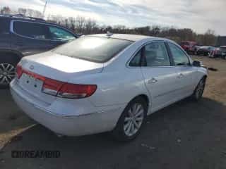 2009 Hyundai Azera GLS z VIN KMHFC46D89A359117, wystawiony jako Copart lot #78143864 z przebiegiem 105 666 mil mil oraz Szkoda całkowita • Salvage title. Historia ofert i sprzedaży dostępna na DreamBid. Obrazek 3.