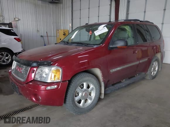 ✅ 2005 GMC Envoy SLE • VIN: 1GKDT13S652352253 • Lot: 42236521. Listed on IAAI with 96,290 mi. Free auction sales archive from the USA and detailed vehicle history report at DreamBid. Image 16.