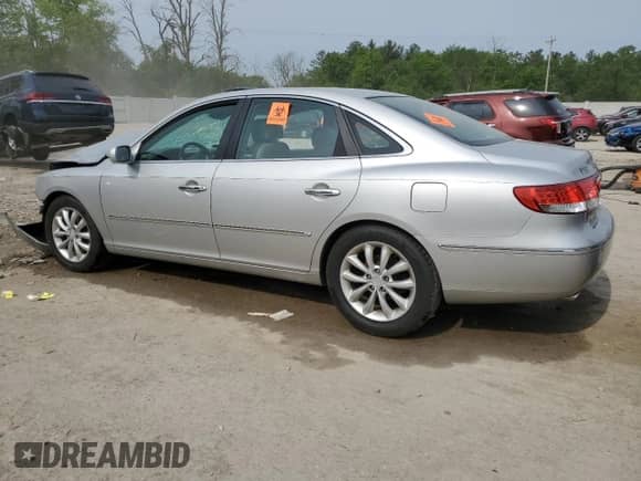 2006 Hyundai Azera SE с VIN KMHFC46FX6A087229, выставлен на аукционе Copart как лот 58816365 с пробегом 152 144 миль миль и На запчасти • Non repairable. История ставок и продаж доступна на DreamBid. Изображение 2.