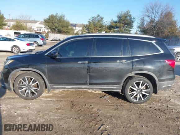 ✅ 2019 Honda Pilot Touring 7-Passenger • VIN: 5FNYF6H65KB061796 • Lot: 41650857. Wystawiony na IAAI z przebiegiem 122 417 mil. Bezpłatny archiwum sprzedaży aukcyjnych z USA i szczegółowy raport historii pojazdu na DreamBid. Zdjęcie 14.