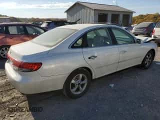 2006 Hyundai Azera SE z VIN KMHFC46FX6A136882, wystawiony jako Copart lot #77377864 z przebiegiem 165 124 mil mil oraz Szkoda całkowita • Salvage title. Historia ofert i sprzedaży dostępna na DreamBid. Obrazek 3.