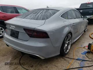 ✅ 2014 Audi RS 7 Prestige • VIN: WUAW2AFCXEN902390 • Лот: 40151564. Опубликован ранее на Copart с пробегом 101 392 миль. Бесплатный доступ к архиву аукционных продаж из США и подробный отчёт об истории автомобиля на DreamBid. Изображение 3.