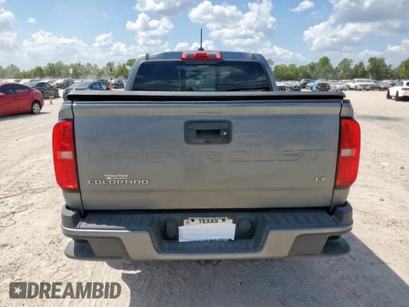 ✅ 2022 Chevrolet Colorado 2WD LT • VIN: 1GCGSCEA2N1296765 • Лот: 81406275. Опубликован ранее на Copart с пробегом 78 601 миль. Бесплатный доступ к архиву аукционных продаж из США и подробный отчёт об истории автомобиля на DreamBid. Изображение 6.