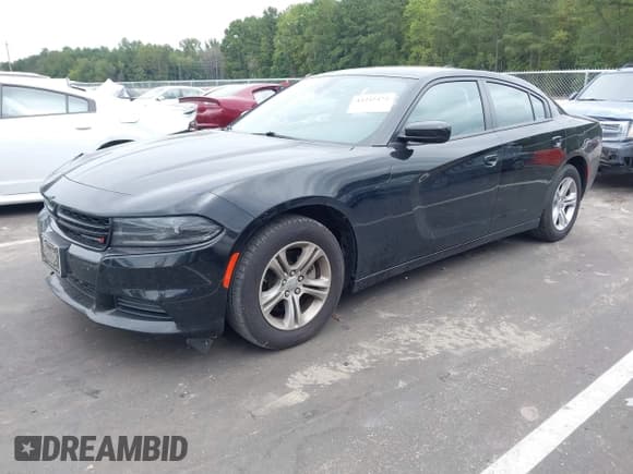 ✅ 2023 Dodge Charger SXT • VIN: 2C3CDXBG5PH579520 • Lot: 43245472. Listed on IAAI with 59,873 mi. Free auction sales archive from the USA and detailed vehicle history report at DreamBid. Image 2.