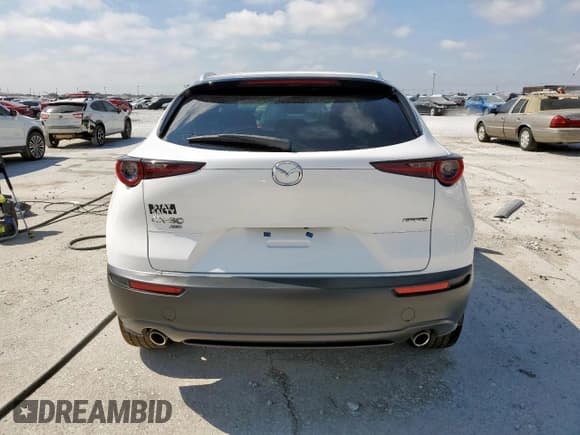 ✅ 2022 Mazda CX-30 S Premium • VIN: 3MVDMBDL6NM458473 • Лот: 66364035. Опубликован ранее на Copart с пробегом 64 305 миль. Бесплатный доступ к архиву аукционных продаж из США и подробный отчёт об истории автомобиля на DreamBid. Изображение 6.