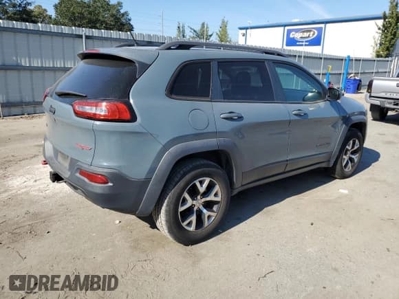 ✅ 2014 Jeep Cherokee Trailhawk • VIN: 1C4PJMBS6EW277774 • Lot: 93860515. Listed on Copart with 164,006 mi. Free auction sales archive from the USA and detailed vehicle history report at DreamBid. Image 3.