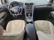 ✅ 2016 Ford Fusion Titanium Hybrid • VIN: 3FA6P0RU9GR191025 • Lot: 66987695. Wystawiony na Copart z przebiegiem 161 893 mil. Bezpłatny archiwum sprzedaży aukcyjnych z USA i szczegółowy raport historii pojazdu na DreamBid. Zdjęcie 8.