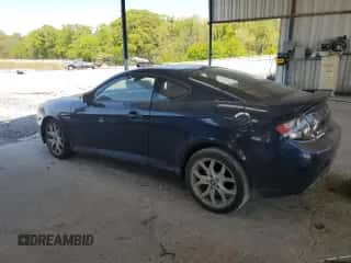 2008 Hyundai Tiburon GT z VIN KMHHN66FX8U280481, wystawiony jako Copart lot #52960165 z przebiegiem 133 063 mil mil oraz Nie do naprawy • Non repairable. Historia ofert i sprzedaży dostępna na DreamBid. Obrazek 2.