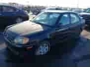 2005 Hyundai Accent GLS z VIN KMHCG45C75U632587, wystawiony jako IAAI lot #40946829 z przebiegiem 114 666 mil mil oraz . Historia ofert i sprzedaży dostępna na DreamBid. Obrazek 2.