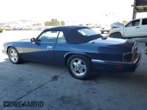 ✅ 1995 Jaguar XJS • VIN: SAJNX2746SC221871 • Lot: 69617935. Listed on Copart with 85,797 mi. Free auction sales archive from the USA and detailed vehicle history report at DreamBid. Image 2.