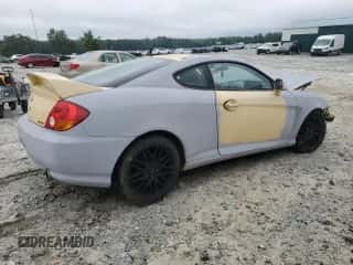 2004 Hyundai Tiburon GT с VIN KMHHN65F94U153085, выставлен на аукционе Copart как лот 65896785 с пробегом Не указан миль и Списание • Salvage title. История ставок и продаж доступна на DreamBid. Изображение 3.