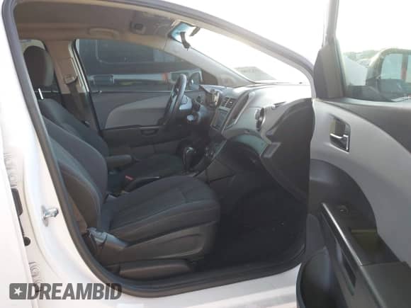 2014 Chevrolet Sonic LT with VIN 1G1JC5SG9E4127762, listed as a IAAI auction lot 43521388 with 128,333 mi miles and . Bid and sale history available at DreamBid. Image 5.