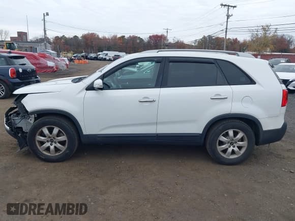 ✅ 2013 Kia Sorento LX • VIN: 5XYKT3A63DG391522 • Lot: 43603504. Listed on IAAI with 132,596 mi. Free auction sales archive from the USA and detailed vehicle history report at DreamBid. Image 14.