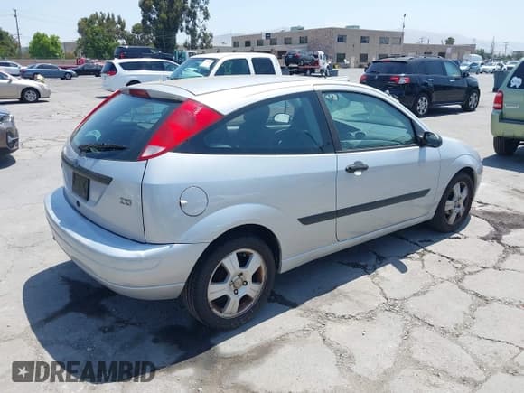 ✅ 2003 Ford Focus ZX3 • VIN: 3FAFP31Z03R173760 • Lot: 42458510. Listed on IAAI with 147,663 mi. Free auction sales archive from the USA and detailed vehicle history report at DreamBid. Image 4.