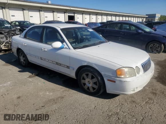 ✅ 2003 Kia Optima LX • VIN: KNAGD128X35205020 • Лот: 76521374. Опубликован ранее на Copart с пробегом 242 323 миль. Бесплатный доступ к архиву аукционных продаж из США и подробный отчёт об истории автомобиля на DreamBid. Изображение 4.