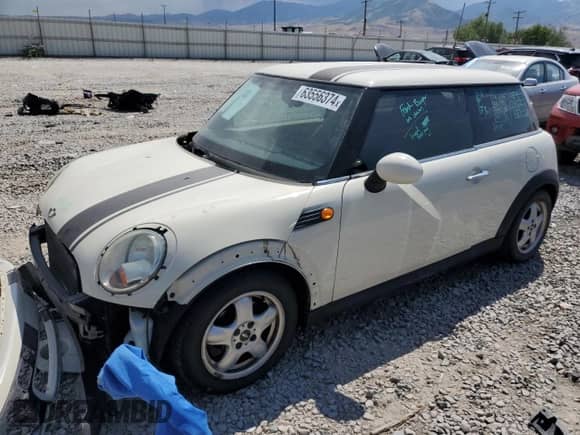 2009 MINI Hardtop with VIN WMWMF33539TT69081, listed as a Copart auction lot 58087205 with 106,470 mi miles and Salvage title. Bid and sale history available at DreamBid. Image 1.