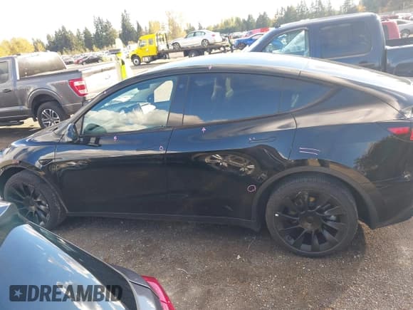 ✅ 2023 Tesla Model Y Long Range • VIN: 7SAYGDEEXPF689909 • Lot: 43551907. Listed on IAAI with 57,191 mi. Free auction sales archive from the USA and detailed vehicle history report at DreamBid. Image 15.